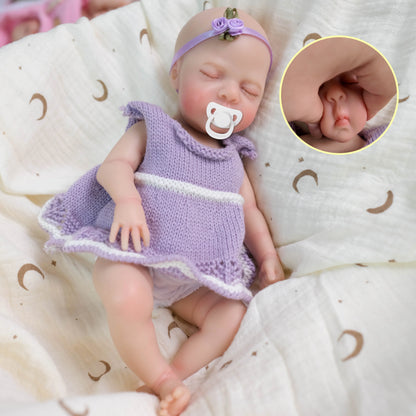 30 cm Luna Reborn-Puppe aus Vollsilikon mit zu öffnendem Mund im lila Kleid