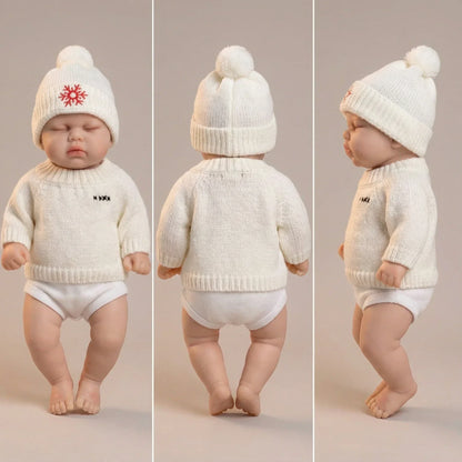 30 cm Reborn-Puppe Pickle aus Vollsilikon mit geschlossenen Augen im weißen Pullover