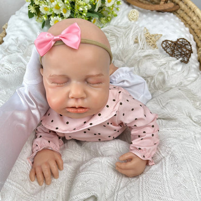 45 cm dehnbare Loulou Reborn Puppe aus Vollsilikon schlafend in rosa gepunktetem Outfit