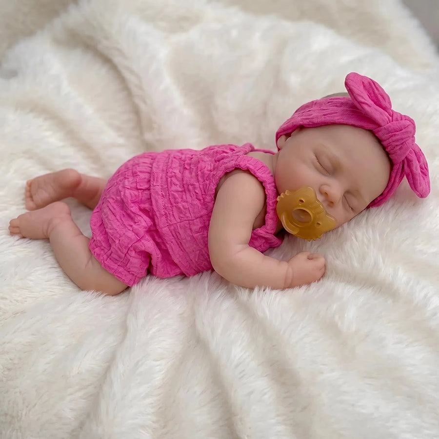 30 cm realistische Irys Reborn-Puppe aus Vollsilikon mit geschlossenen Augen in rosafarbenen Outfits