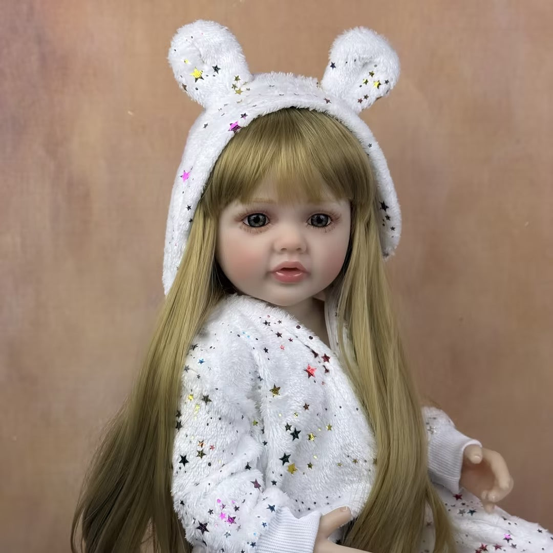 55 cm rebornte Baby-Dame Betty mit offenen Augen und langen blonden Haaren im Sternen-Jumpsuit