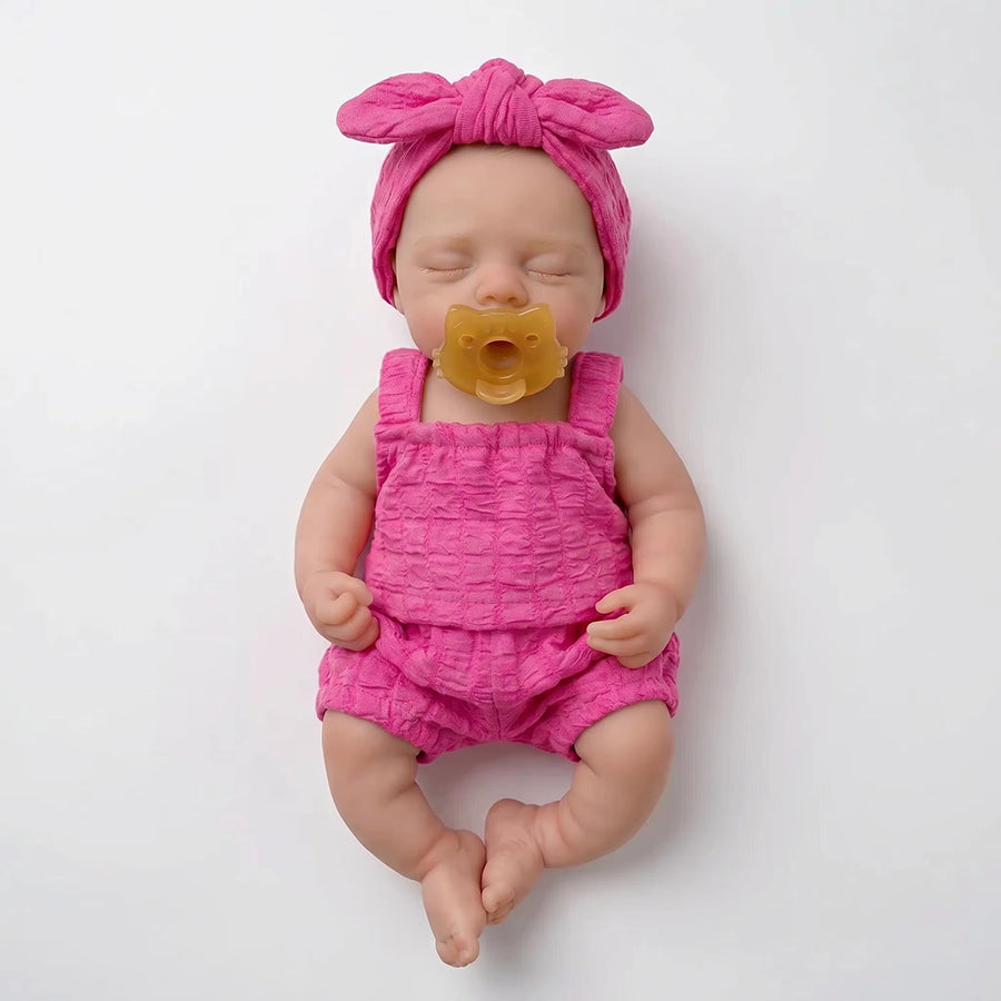 30 cm realistische Irys Reborn-Puppe aus Vollsilikon mit geschlossenen Augen in rosafarbenen Outfits
