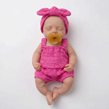 30 cm realistische Irys Reborn-Puppe aus Vollsilikon mit geschlossenen Augen in rosafarbenen Outfits