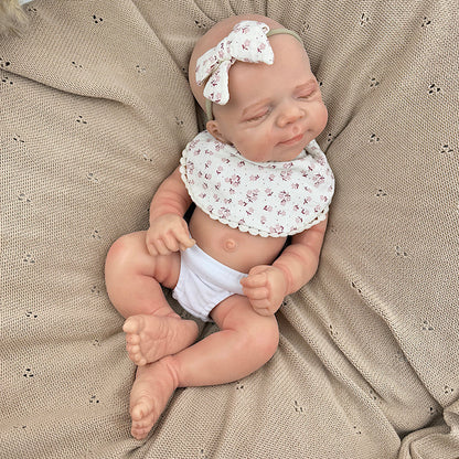 45cm dehnbares schlafendes Pascale Reborn Baby aus Vollsilikon mit Lätzchen mit Blumenmuster