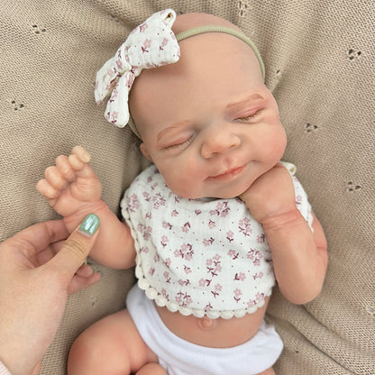 45cm dehnbares schlafendes Pascale Reborn Baby aus Vollsilikon mit Lätzchen mit Blumenmuster