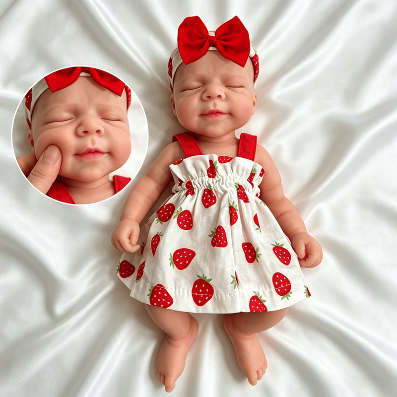 30cm weiches dehnbares Pascale Reborn Baby aus Vollsilikon mit geschlossenen Augen in einem Erdbeerkleid