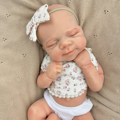 45cm dehnbares schlafendes Pascale Reborn Baby aus Vollsilikon mit Lätzchen mit Blumenmuster