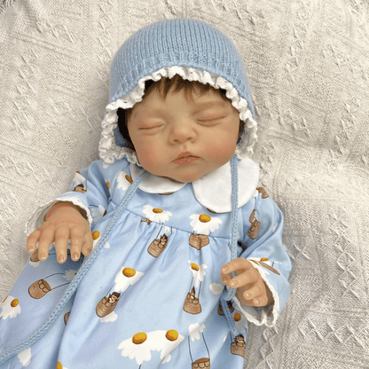 48 cm 3D-bemalte Reborn-Puppe Irys mit geschlossenen Augen und kurzem Haar im blauen Kleid