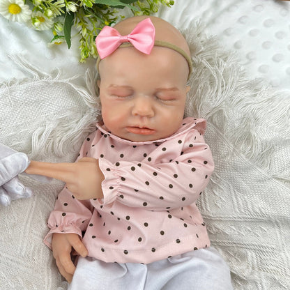 45 cm dehnbare Loulou Reborn Puppe aus Vollsilikon schlafend in rosa gepunktetem Outfit