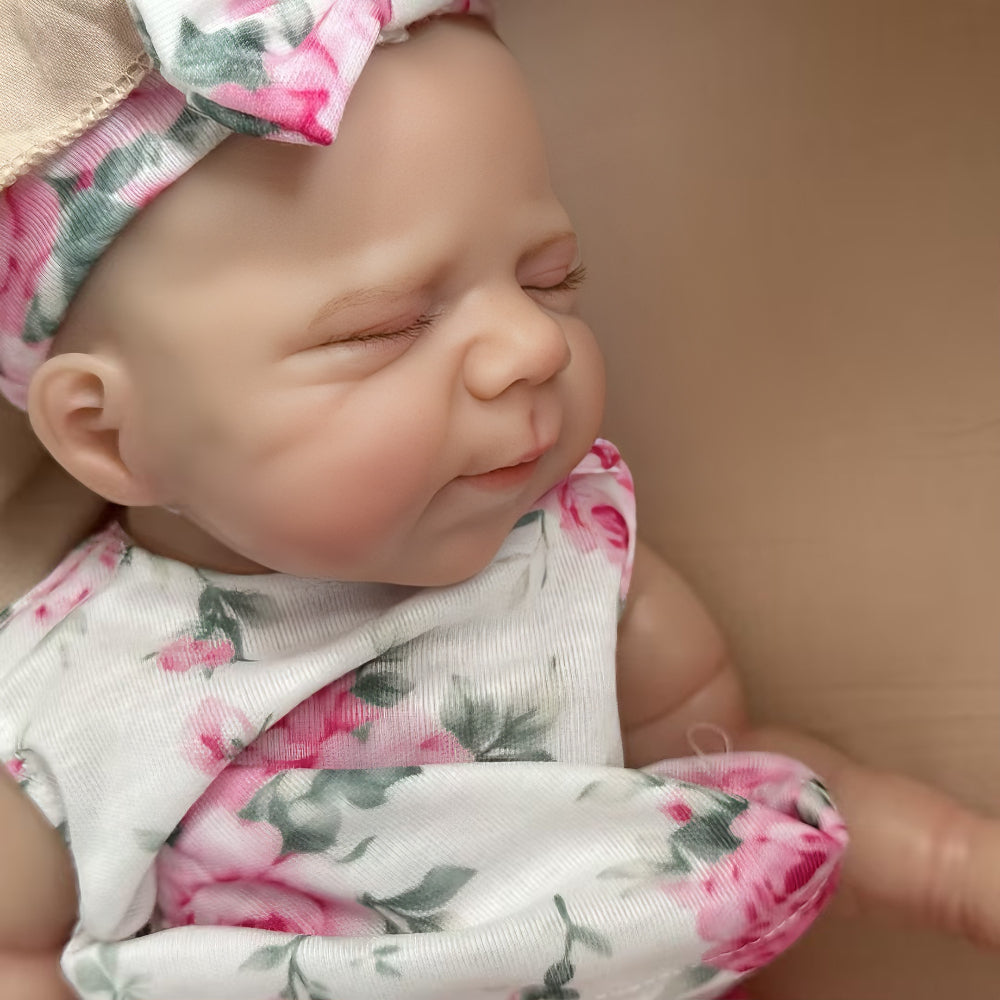 30 cm niedliche Pascale Reborn Puppe aus Vollsilikon in rosa geblümtem Outfit