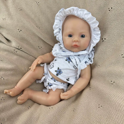 30 cm vollständig aus Silikon gefertigtes Reborn Baby Meadow Mädchen in weißer Blumenkleidung