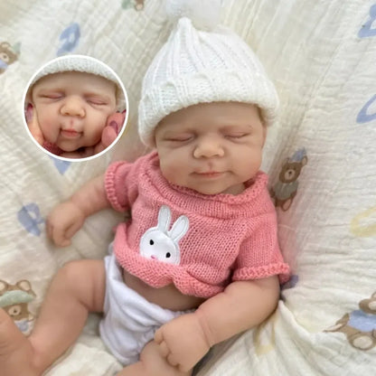 30 cm Pascale Soft Reborn Puppe aus Vollsilikon mit geschlossenen Augen und rosa Pullover