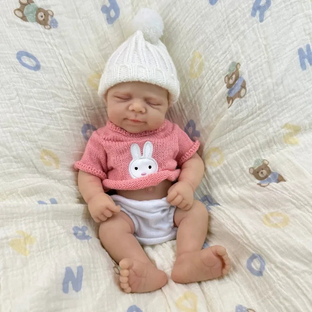 30 cm Pascale Soft Reborn Puppe aus Vollsilikon mit geschlossenen Augen und rosa Pullover