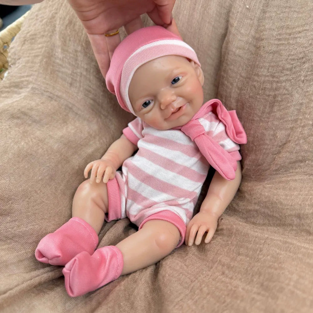 30 cm lebensechtes Lächeln Vollsilikon blaue Augen Charlie Reborn-Mädchen in rosa gestreifter Kleidung