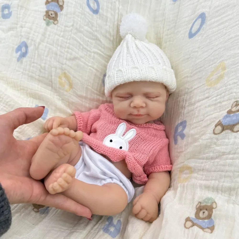 30 cm Pascale Soft Reborn Puppe aus Vollsilikon mit geschlossenen Augen und rosa Pullover