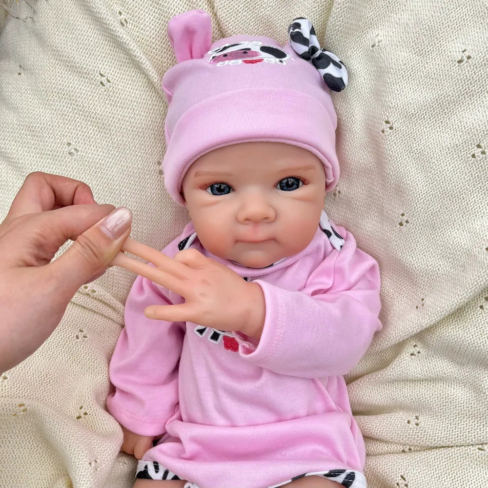 45 cm lebensechte Bettie Reborn Puppe aus Vollsilikon in rosa Outfits