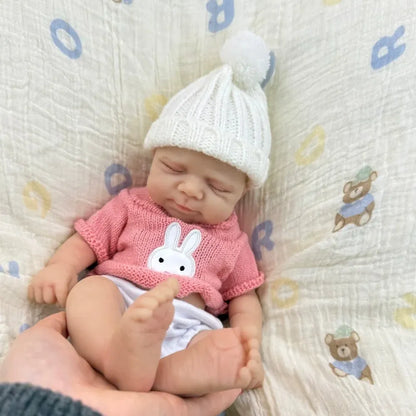 30 cm Pascale Soft Reborn Puppe aus Vollsilikon mit geschlossenen Augen und rosa Pullover