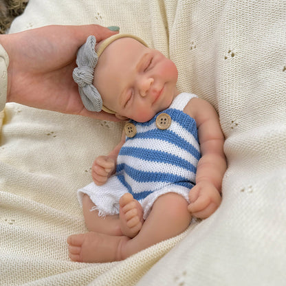 30 cm lebensechte Pascale Reborn Babypuppe aus Vollsilikon mit geschlossenen Augen in blau weiß gestreiftem Outfit