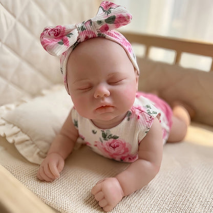 30cm Pickle Reborn Puppe aus Vollsilikon mit geschlossenen Augen im geblümten Outfit