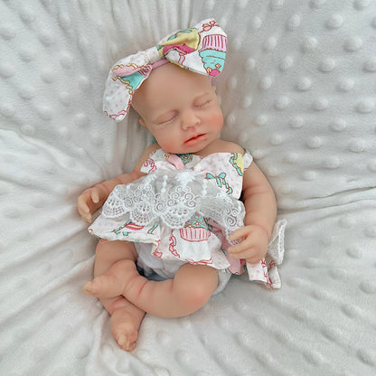 30cm Loulou Reborn Baby aus Vollsilikon mit geschlossenen Augen in einem Spitzenkleid mit Blumenmuster