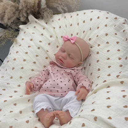 45 cm dehnbare Loulou Reborn Puppe aus Vollsilikon schlafend in rosa gepunktetem Outfit