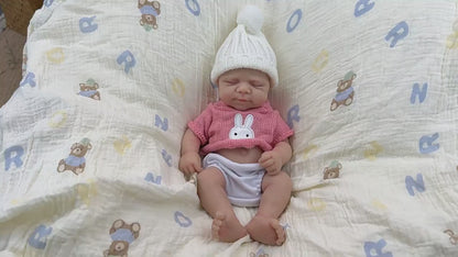 30 cm Pascale Soft Reborn Puppe aus Vollsilikon mit geschlossenen Augen und rosa Pullover