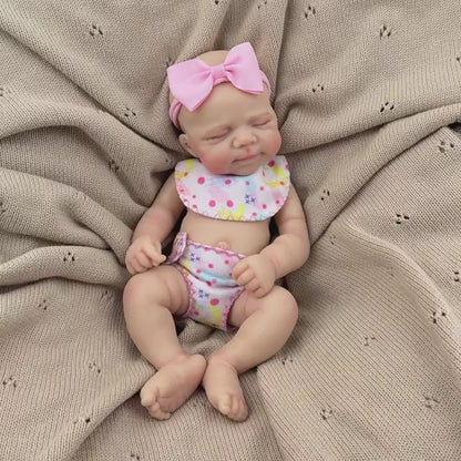 30 cm schlafende Pascale Reborn-Puppe aus Vollsilikon in rosa Blumenkleid